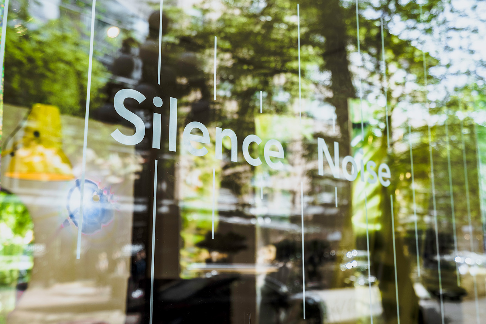 Closeup of words on window 'Silence Noise' installation for inform window display by Cutler Vancouver