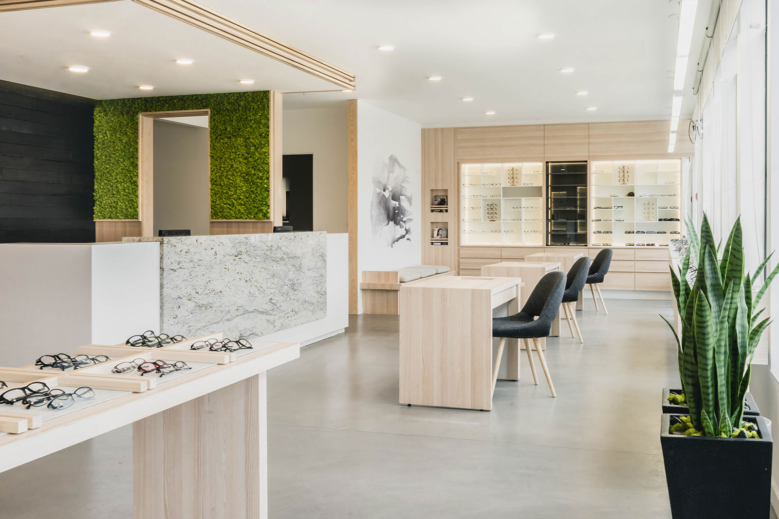 Boardwalk Optometry retail interior showing retail product displays, chairs & desks, ceiling and walls, in Surrey BC by Cutler