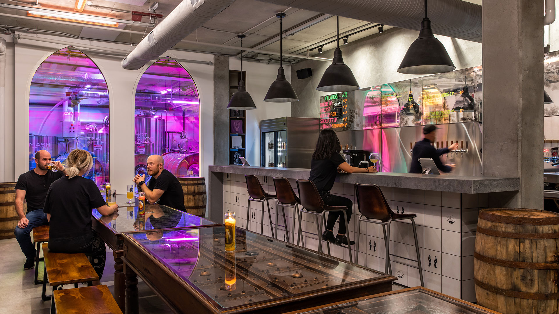 People enjoying libations at House of Funk Brewery in Vancouver BC Canada, with interior bar design by Cutler