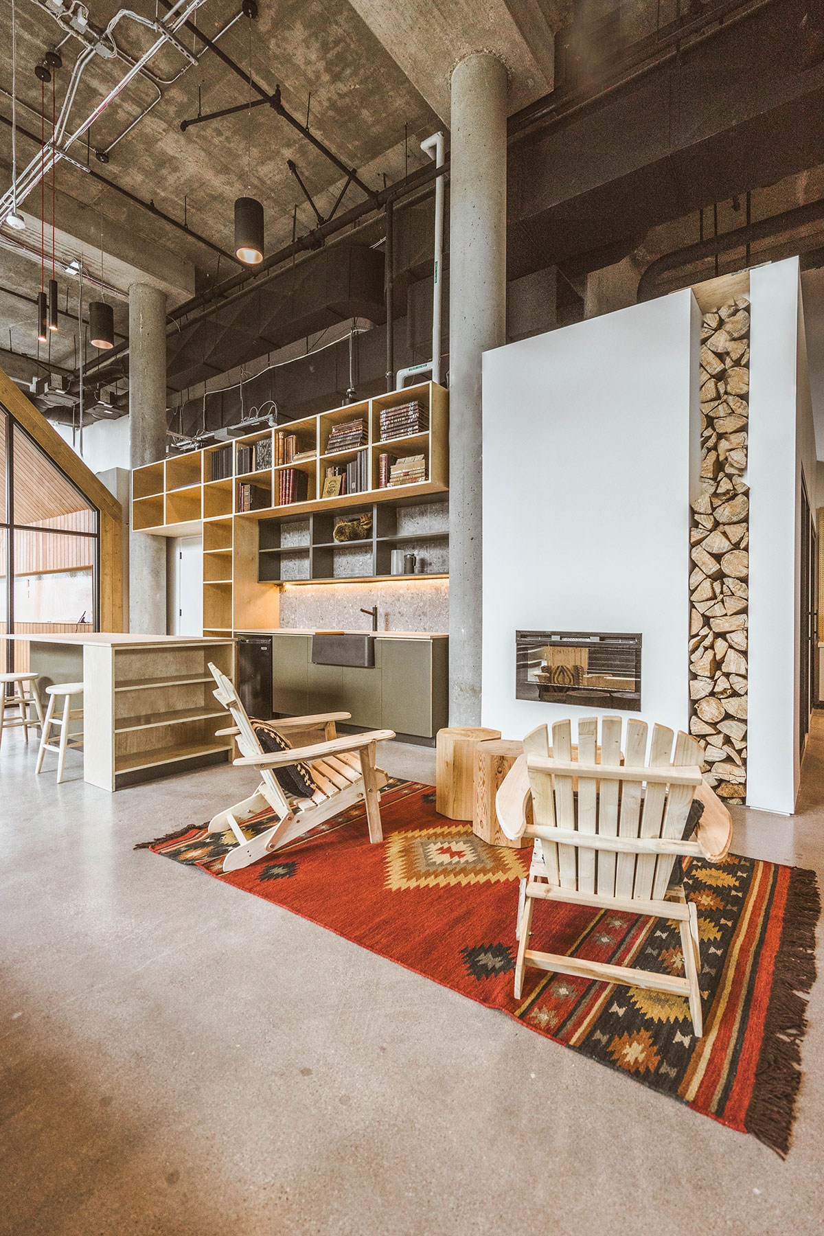 Woods showroom interior in Vancouver BC with wood finished cabinets, chairs, and cozy throw carpet