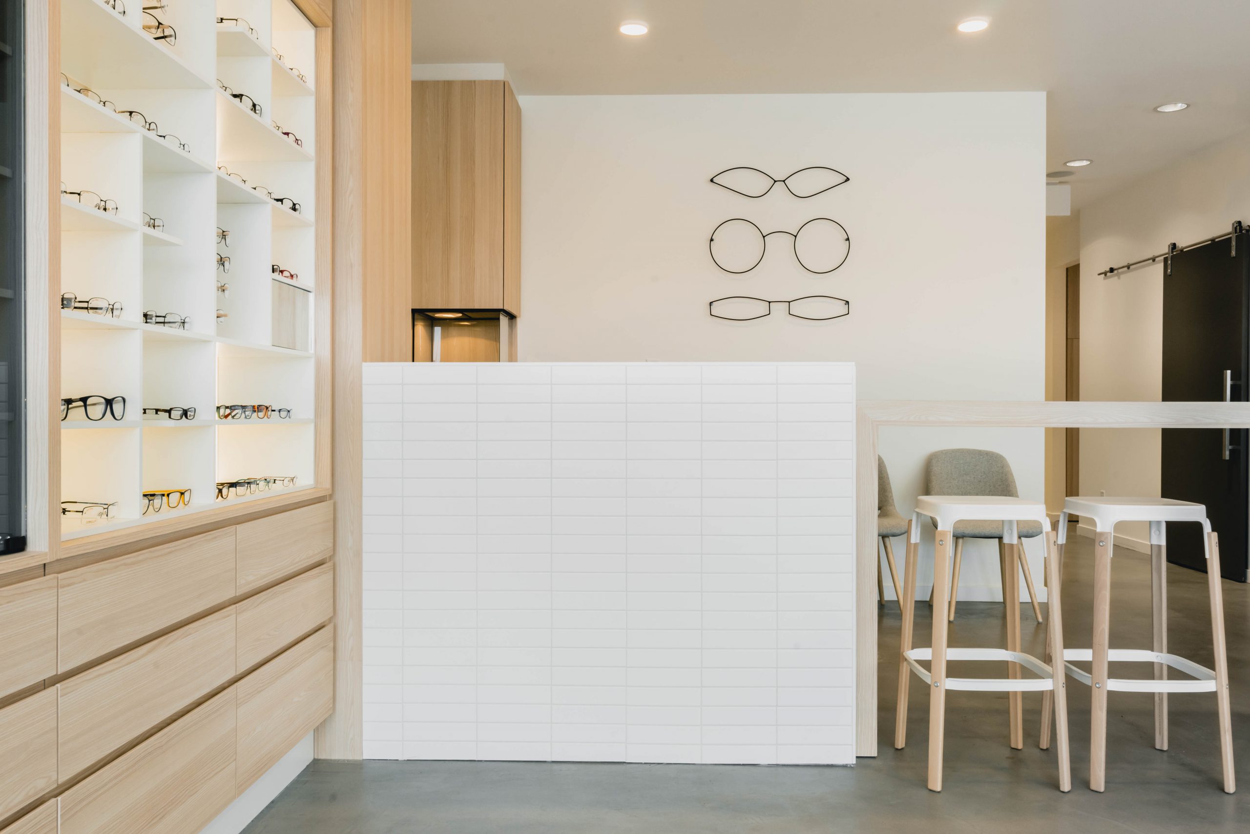 Boardwalk Optometry in Surrey BC Retail Optometry Interior Design Desk and Stools by Cutler
