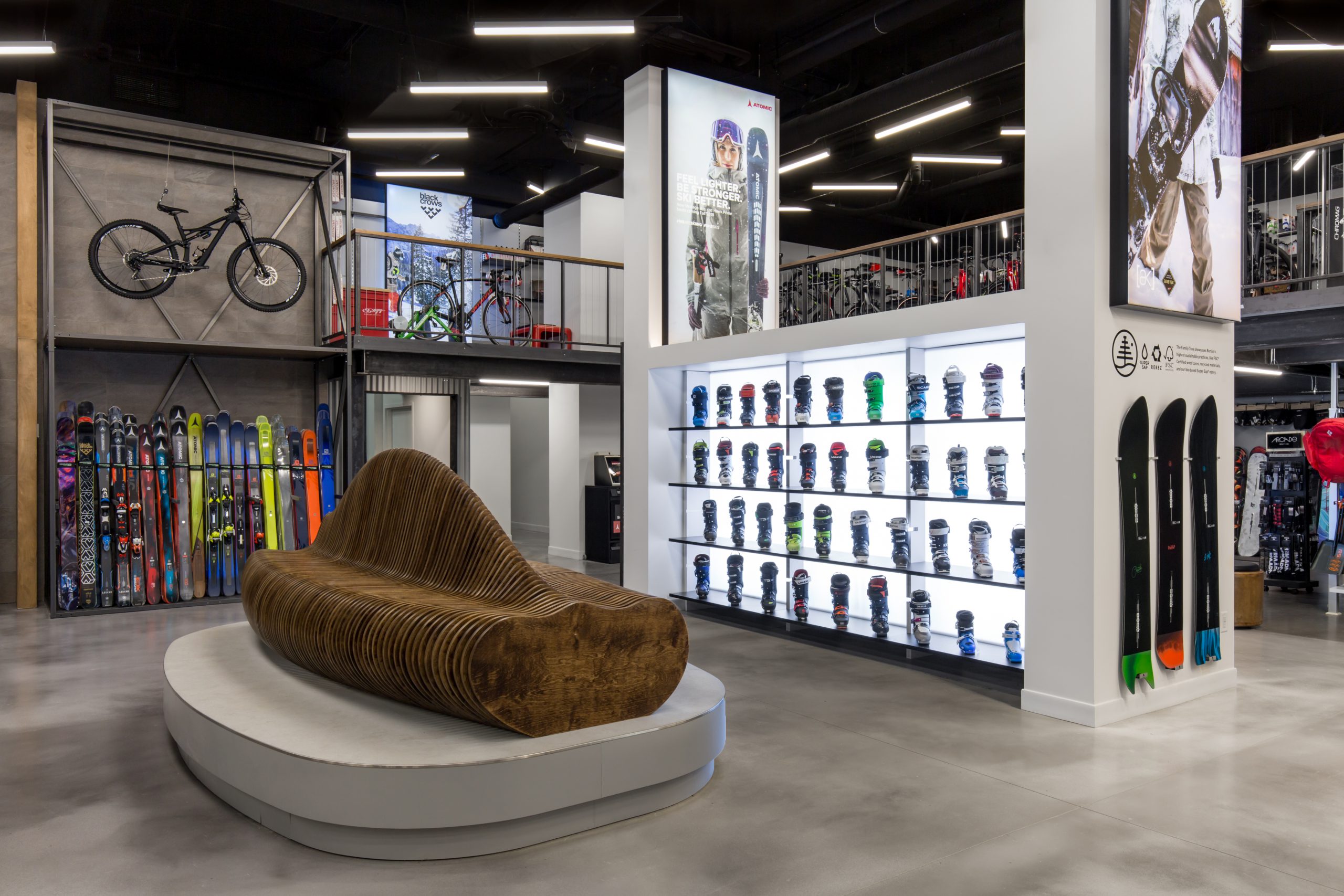 Comor Sports flagship location retail interior showing product displays and customer seating, by Cutler in Vancouver BC