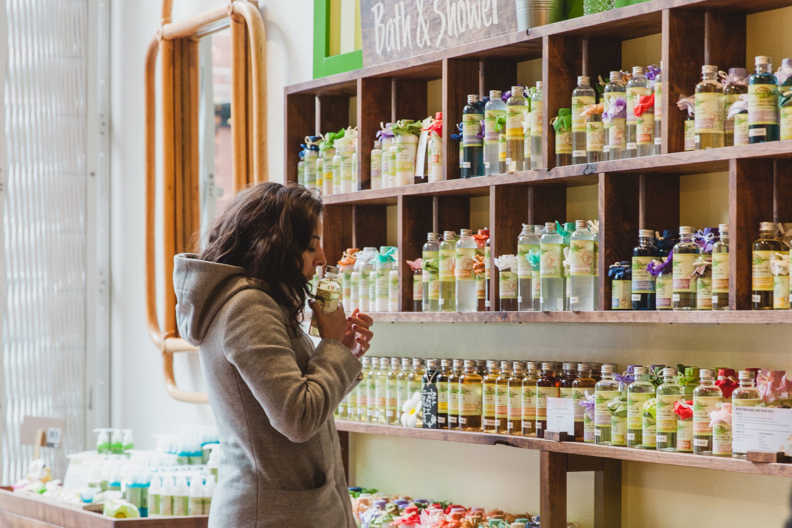 Customer browsing product in bright well light retail store interior space