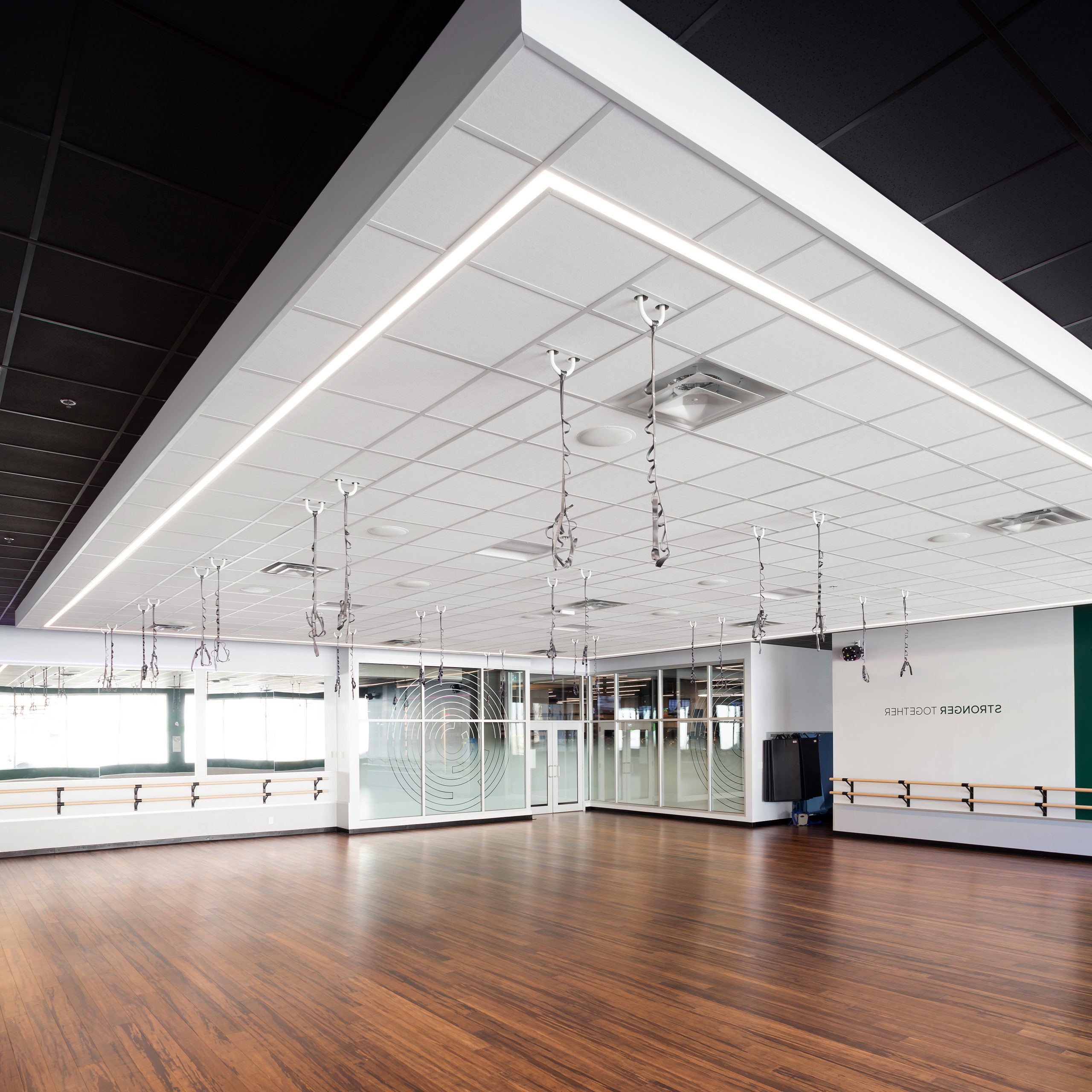 Fitness space interior showing wood panel floors and barre bars at Steve Nash Fitness in Vancouver BC