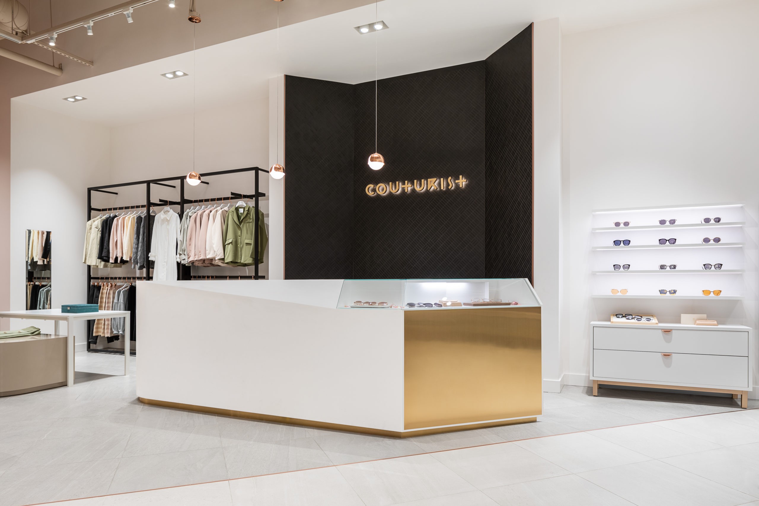 Couturist in Burnaby  BC Retail & Showroom Interior Design Cash desk and feature wall  by Cutler