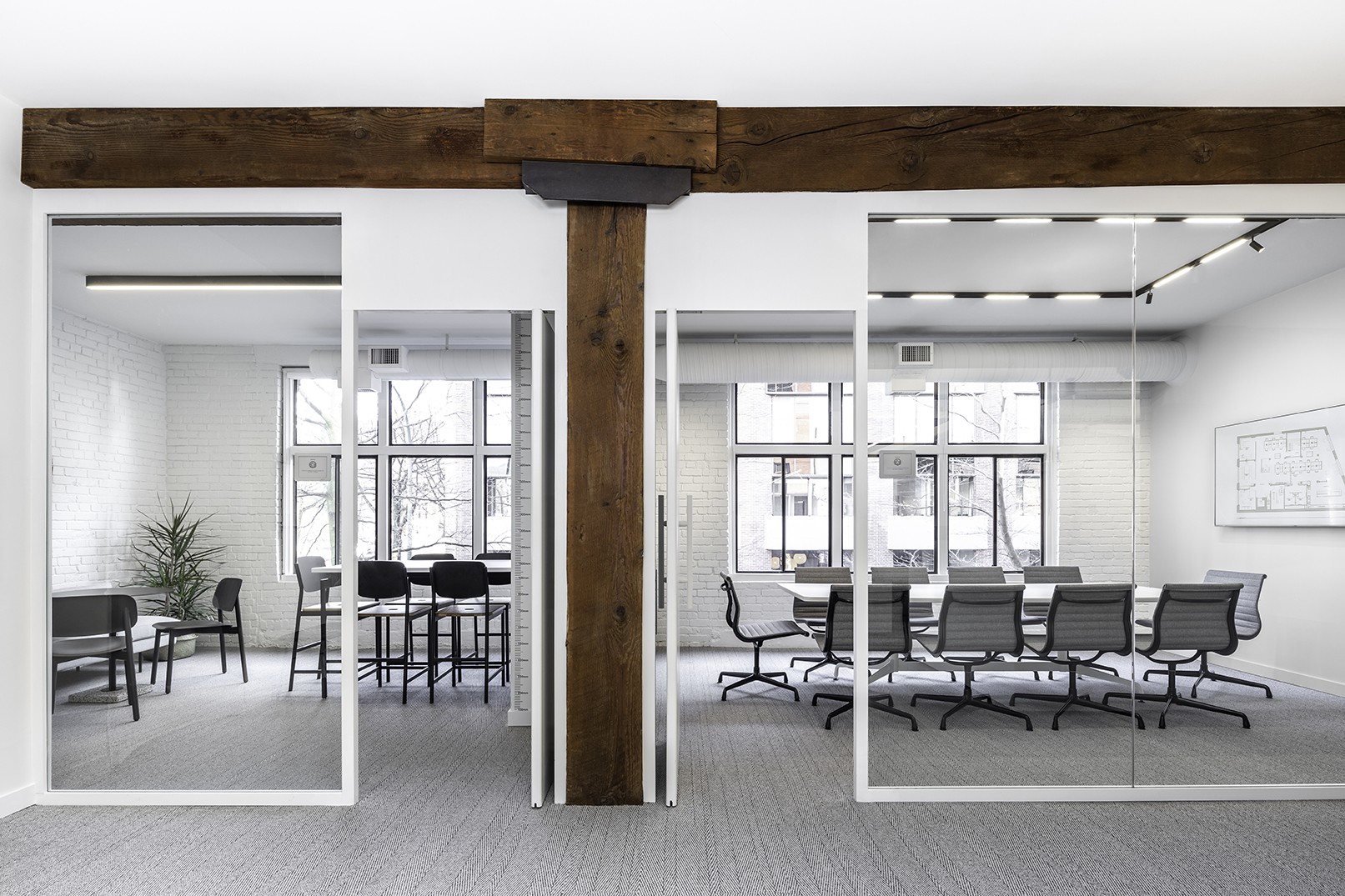 Cutler conference room interior design in Vancouver BC with glass panel walls and large windows
