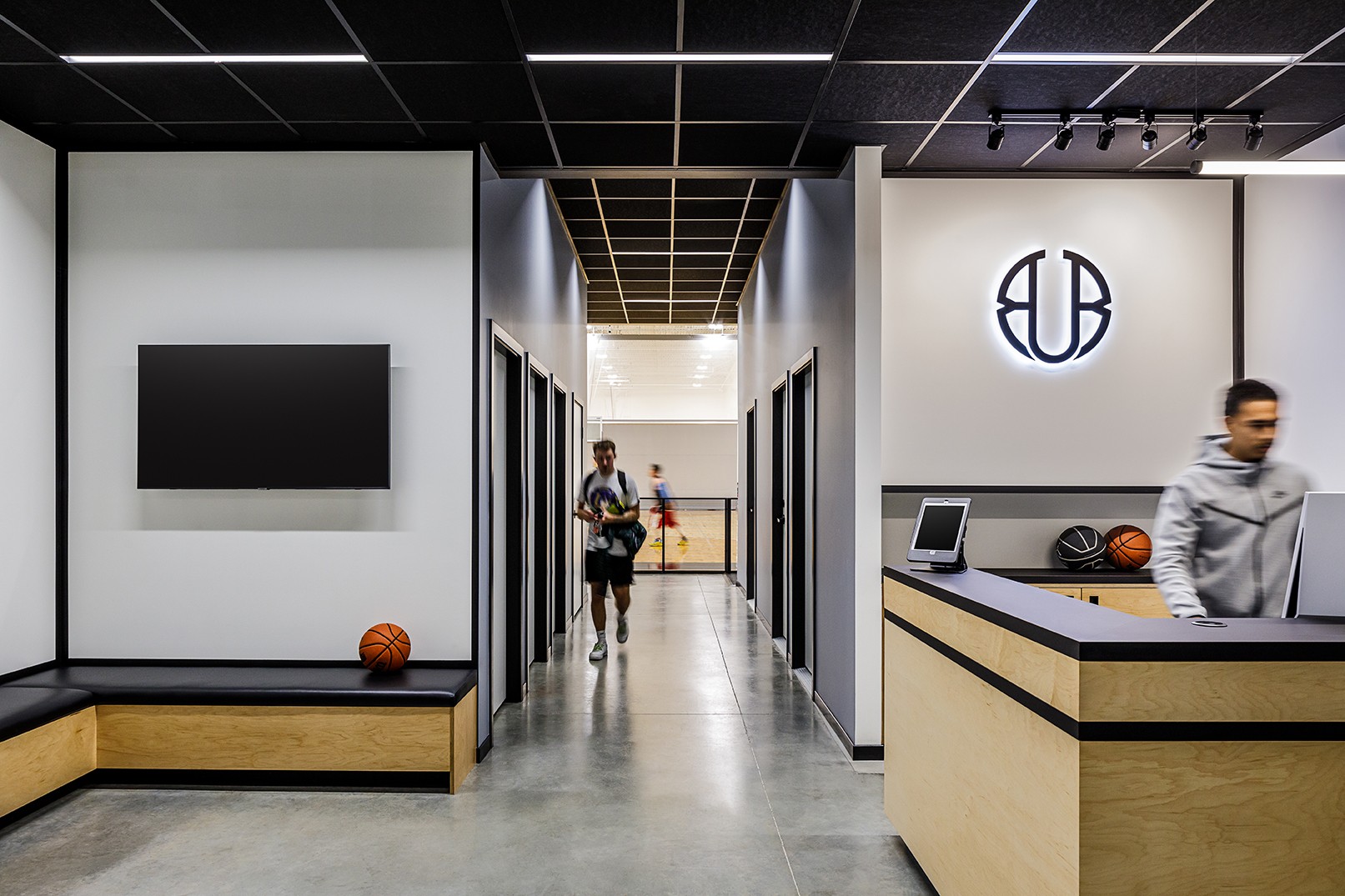 Union Basketball interior in Richmond BC, showing check in desk and hallway looking towards the gym
