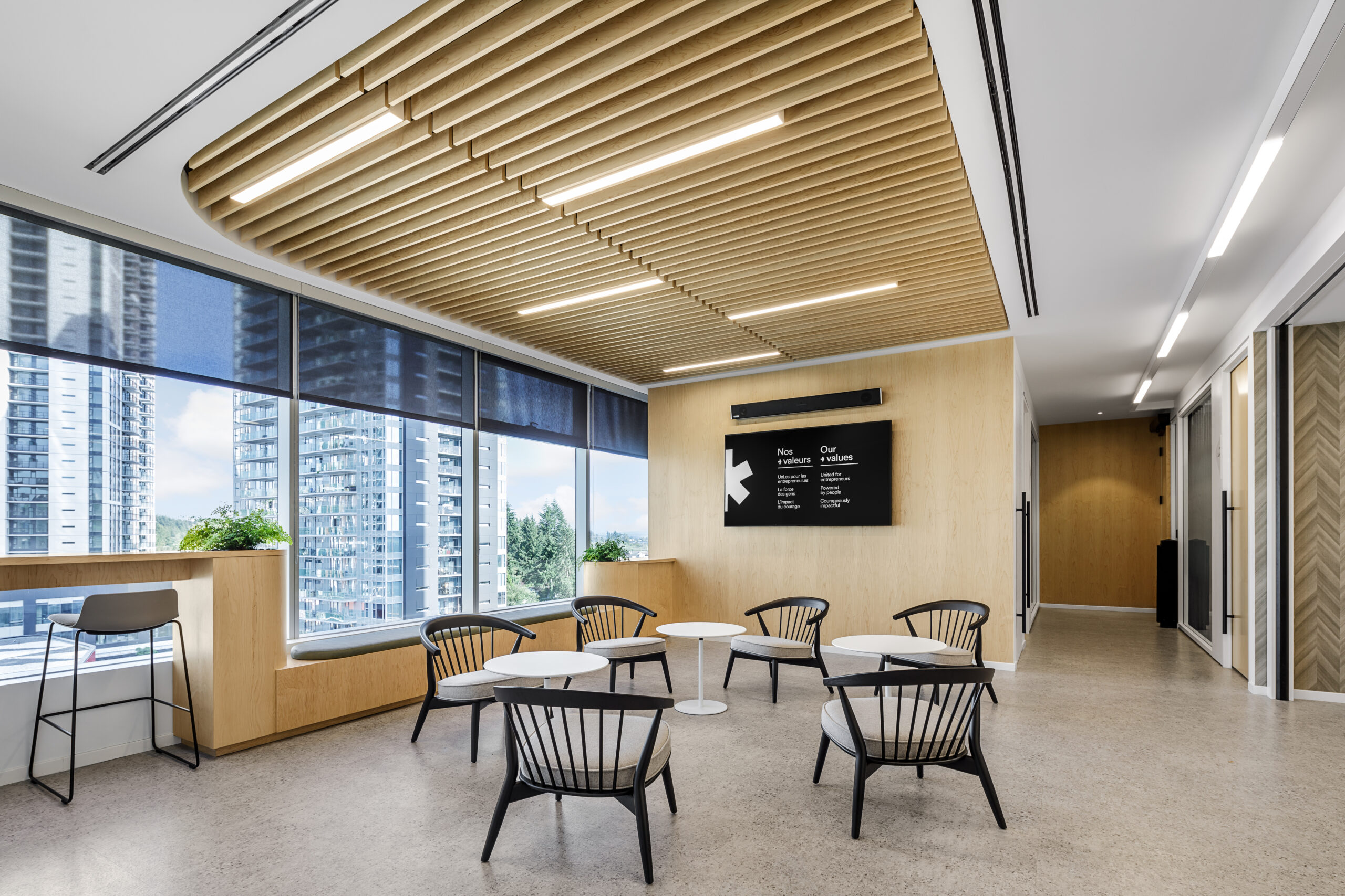 Nature-inspired workspace with abundant daylight, timber ceiling and open views in a Cutler-designed office