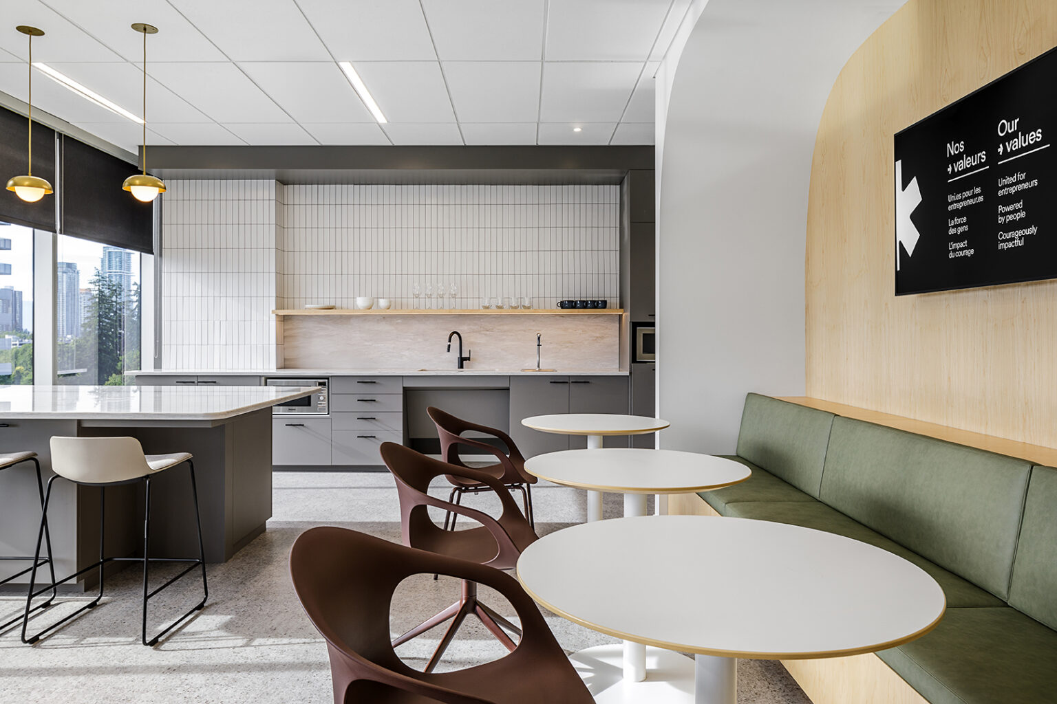 Office coffee point and café seating placed on a shared circulation route between team neighbourhoods at BDC Surrey